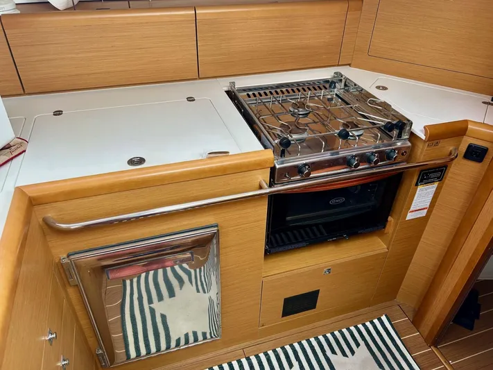 Charisapa Yacht Photos Pics Modern kitchen area in a 2012 Jeanneau 50 DS yacht with stove and oven.
