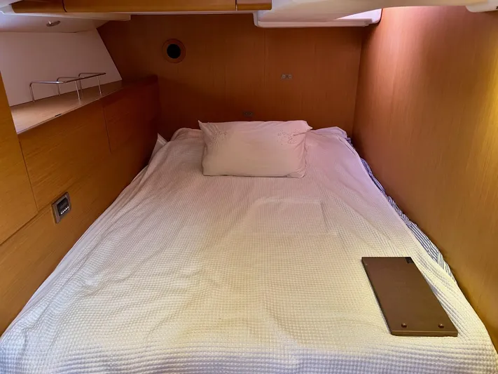Charisapa Yacht Photos Pics Cozy cabin interior of 2012 Jeanneau 50 DS sailboat with comfortable bedding.