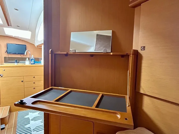 Charisapa Yacht Photos Pics Interior of 2012 Jeanneau 50 DS yacht with wooden cabinetry and modern amenities.