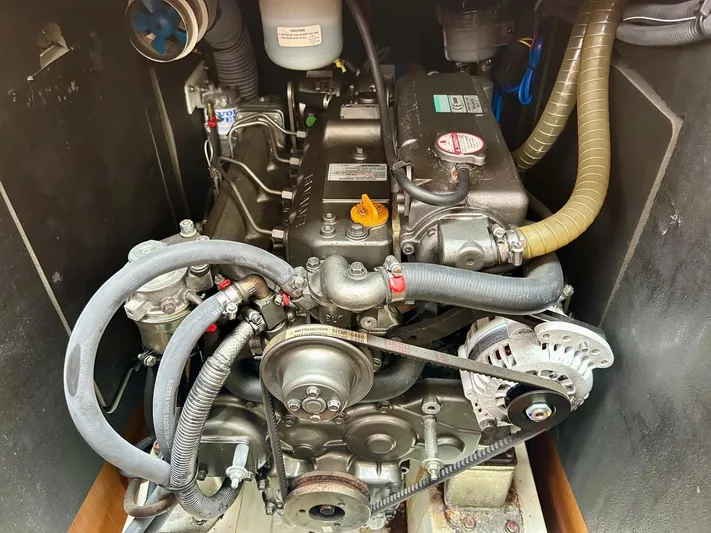 Charisapa Yacht Photos Pics Engine compartment of a 2012 Jeanneau 50 DS sailboat, showcasing mechanical components.