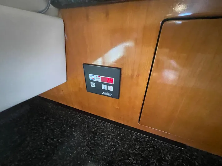  Yacht Photos Pics Control panel on 2000 Carver 506 Motor Yacht's wooden interior.