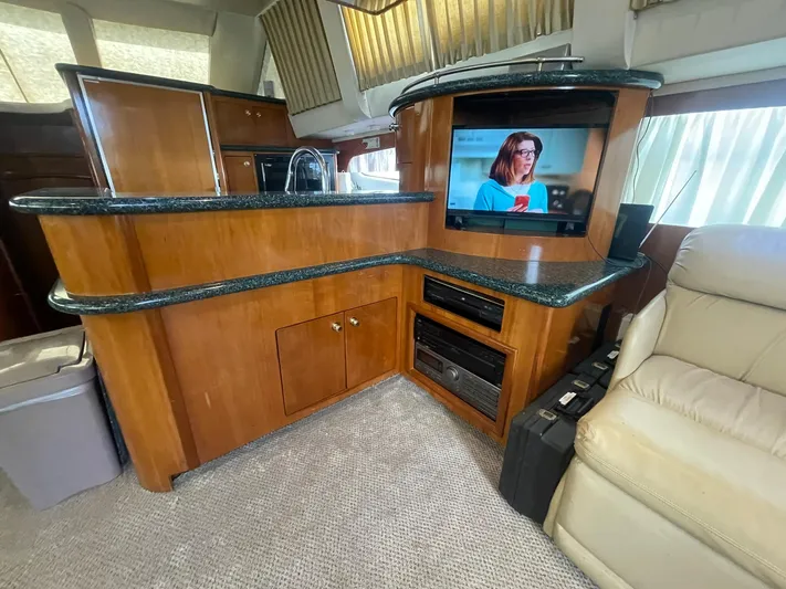  Yacht Photos Pics Interior of 2000 Carver 506 Motor Yacht with wood cabinetry and TV.