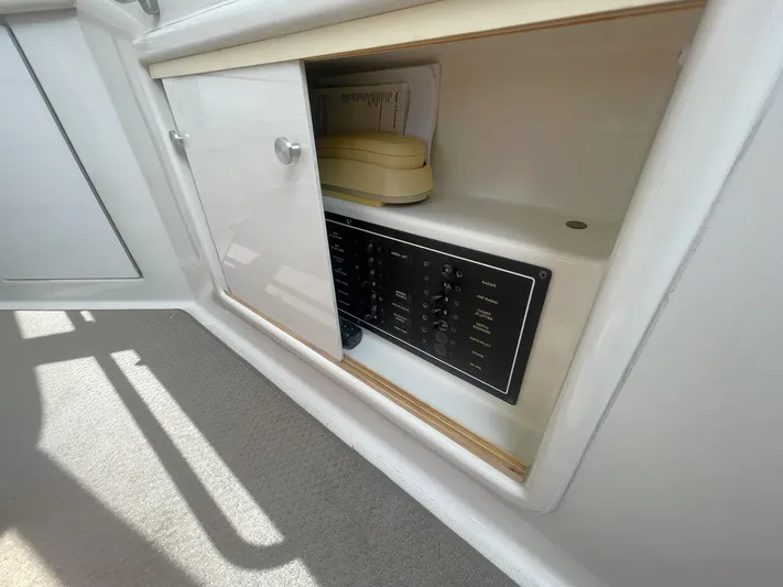  Yacht Photos Pics Carver 506 Motor Yacht 2000 electrical panel inside cabinet with phone.