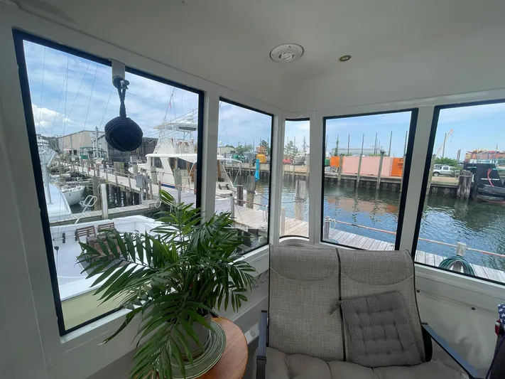  Yacht Photos Pics Interior view of 2000 Carver 506 Motor Yacht with marina backdrop.