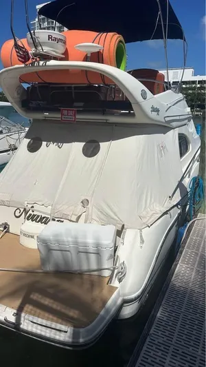 Nirvana Yacht Photos Pics 2004 Cranchi Atlantique 40 Flybridge yacht docked, featuring covered deck and flybridge.