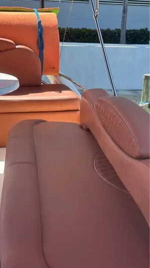 Nirvana Yacht Photos Pics 2004 Cranchi Atlantique 40 Flybridge with brown leather seating on deck.