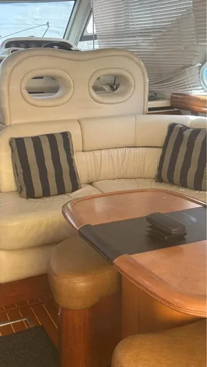 Nirvana Yacht Photos Pics Interior of 2004 Cranchi Atlantique 40 Flybridge with leather seating and striped cushions.