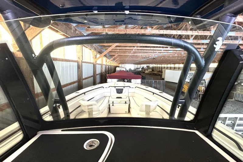  Yacht Photos Pics 2019 Wellcraft 302 Fisherman boat interior view in storage facility.