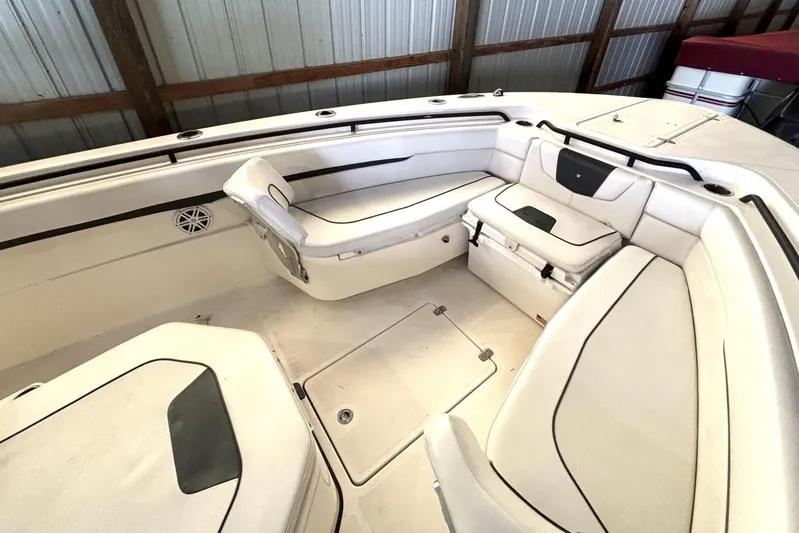  Yacht Photos Pics 2019 Wellcraft 302 Fisherman boat interior with cushioned seating and storage compartments.