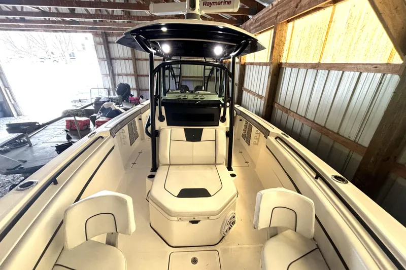  Yacht Photos Pics 2019 Wellcraft 302 Fisherman boat interior in a wooden storage shed.