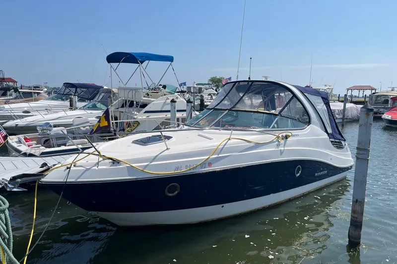  Yacht Photos Pics 2020 Rinker 290 EX boat docked at marina on a sunny day.