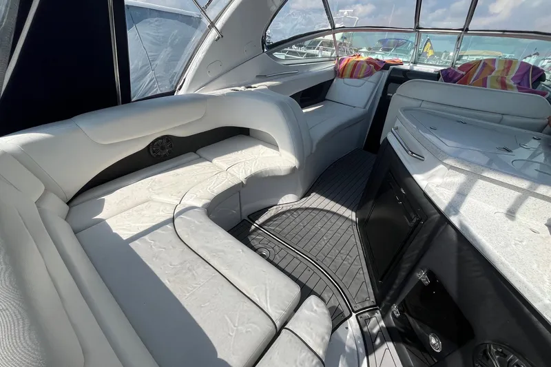  Yacht Photos Pics 2020 Rinker 290 EX boat interior with white seating and modern design.