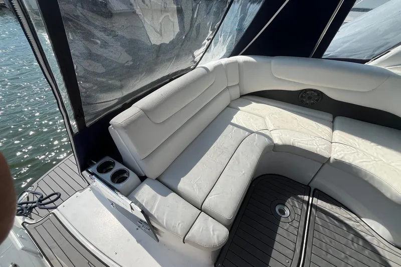  Yacht Photos Pics 2020 Rinker 290 EX boat interior with white seating and cup holders.
