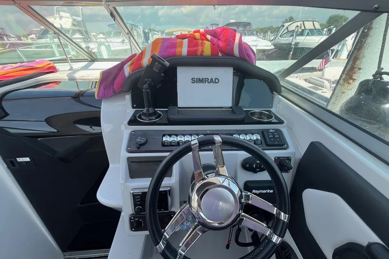  Yacht Photos Pics 2020 Rinker 290 EX boat helm with Simrad navigation system and Raymarine controls.