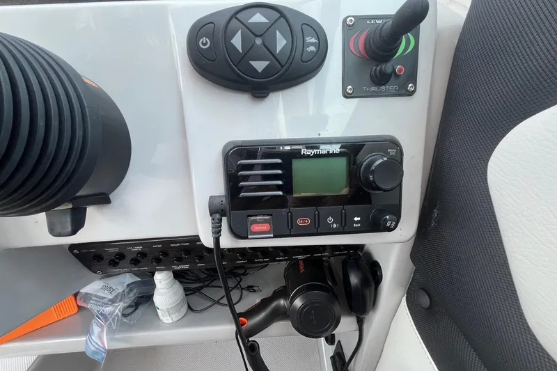  Yacht Photos Pics Control panel of 2020 Rinker 290 EX boat with Raymarine equipment and joystick.