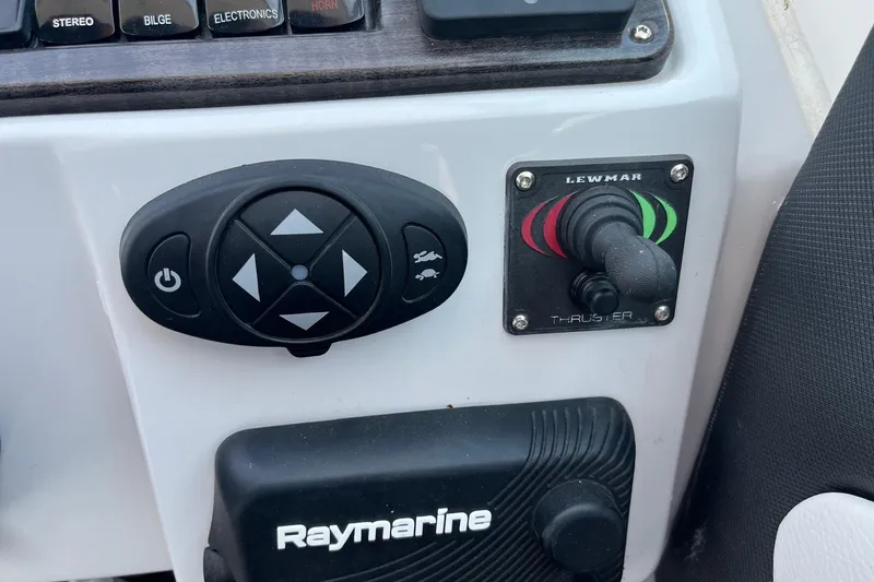  Yacht Photos Pics Control panel of a 2020 Rinker 290 EX boat with Lewmar thruster and Raymarine equipment.