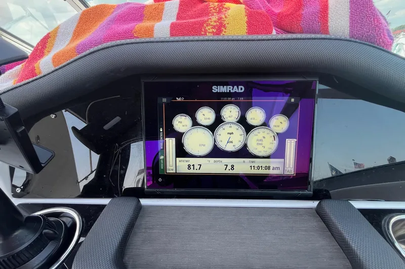  Yacht Photos Pics 2020 Rinker 290 EX boat dashboard with Simrad display and colorful towel.