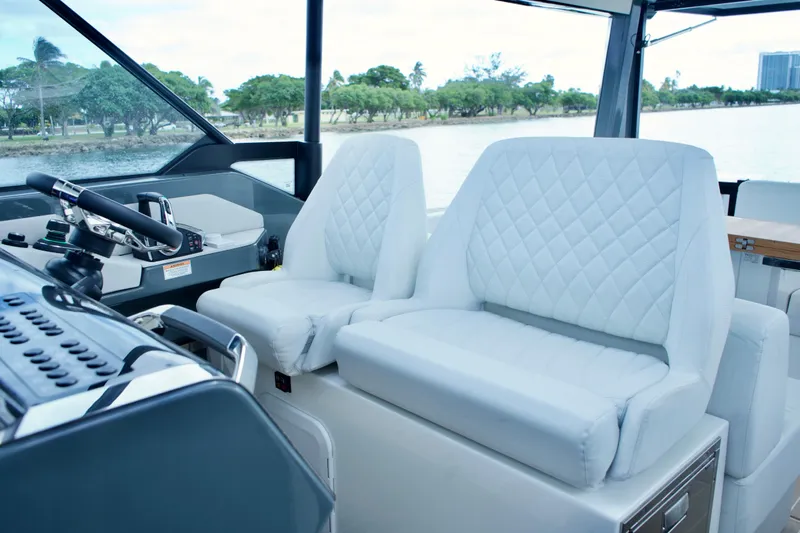 Sierra Tango VI Yacht Photos Pics Luxurious interior of 2025 Saxdor 400 GTO boat with quilted white seats.