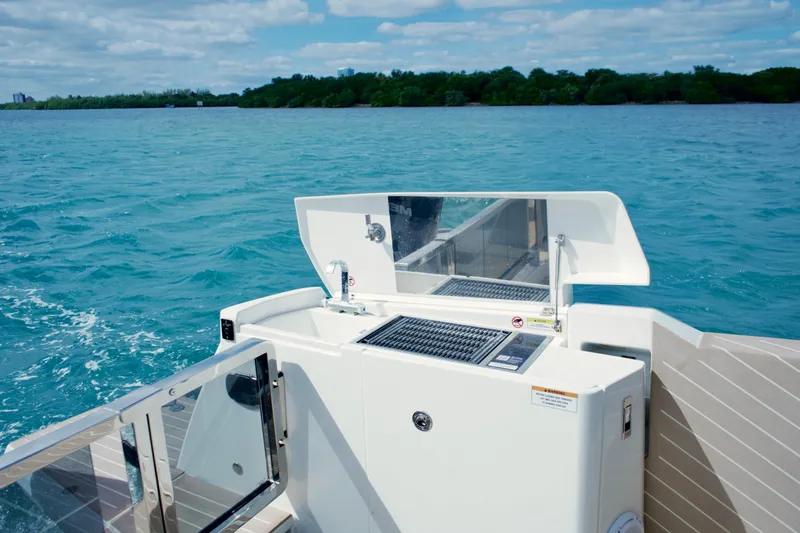 Sierra Tango VI Yacht Photos Pics 2025 Saxdor 400 GTO yacht with outdoor kitchen on turquoise water.