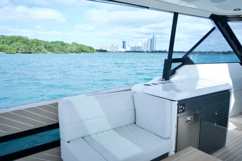 Sierra Tango VI Yacht Photos Pics 2025 Saxdor 400 GTO luxury yacht interior with ocean view and city skyline.