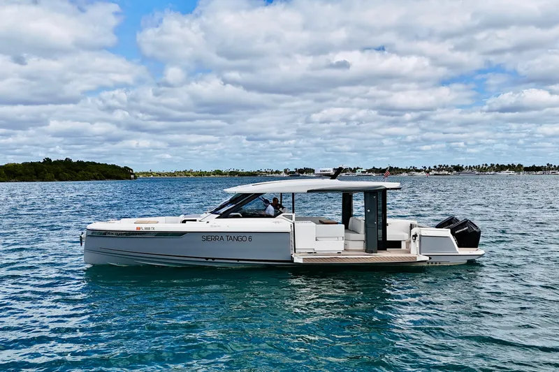 Sierra Tango VI Yacht Photos Pics 2025 Saxdor 400 GTO boat cruising on a sunny day with scenic ocean backdrop.
