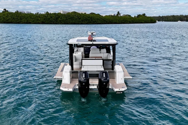 Sierra Tango VI Yacht Photos Pics 2025 Saxdor 400 GTO luxury boat on serene water with dual engines.