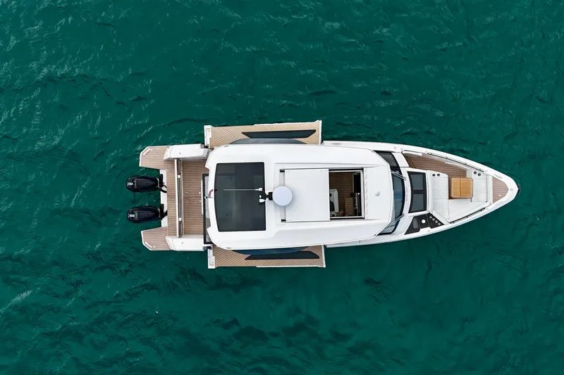Sierra Tango VI Yacht Photos Pics Top view of 2025 Saxdor 400 GTO yacht on turquoise water.