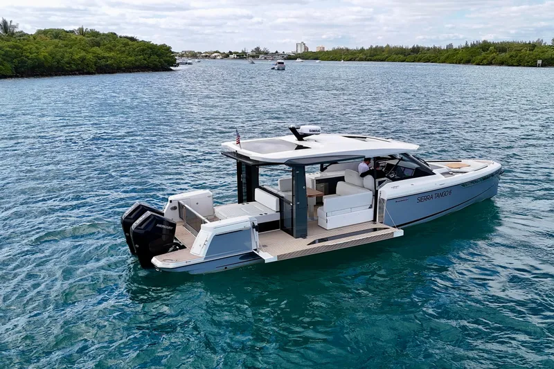 Sierra Tango VI Yacht Photos Pics 2025 Saxdor 400 GTO luxury boat cruising on clear blue water.