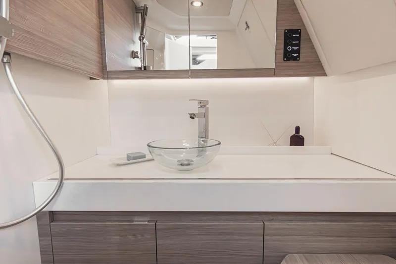 Sierra Tango VI Yacht Photos Pics Modern bathroom interior of 2025 Saxdor 400 GTO yacht with glass sink and sleek design.