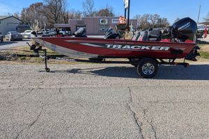 2025 Tracker Pro Team 175 boat on trailer, parked outdoors, side view.