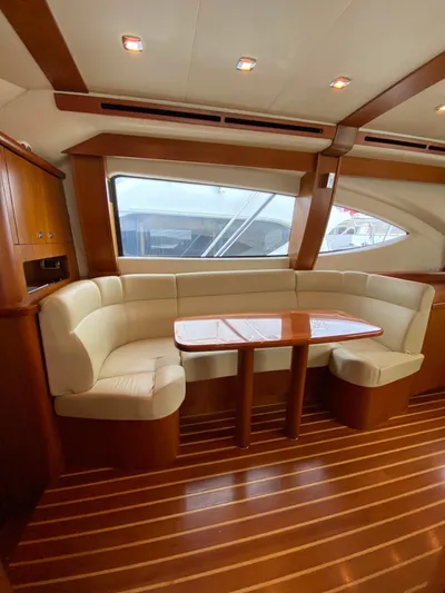  Yacht Photos Pics Luxurious interior of 2012 Tiara Yachts 48 Convertible with elegant seating and wooden finishes.