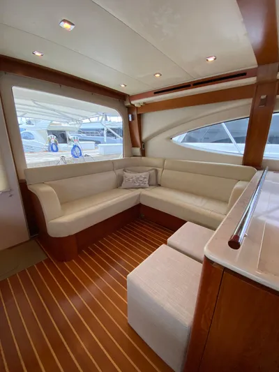  Yacht Photos Pics Interior of 2012 Tiara Yachts 48 Convertible with elegant seating and wood flooring.