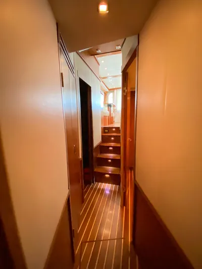  Yacht Photos Pics Interior hallway of 2012 Tiara Yachts 48 Convertible with wooden flooring and ambient lighting.