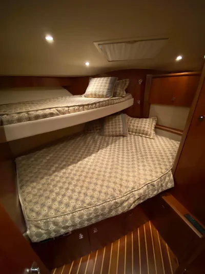  Yacht Photos Pics 2012 Tiara Yachts 48 Convertible cabin with cozy twin beds and elegant lighting.