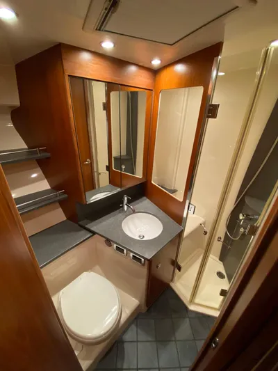  Yacht Photos Pics Luxurious bathroom in 2012 Tiara Yachts 48 Convertible with modern fixtures and wood accents.