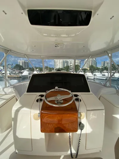  Yacht Photos Pics Helm of 2012 Tiara Yachts 48 Convertible with cityscape view.