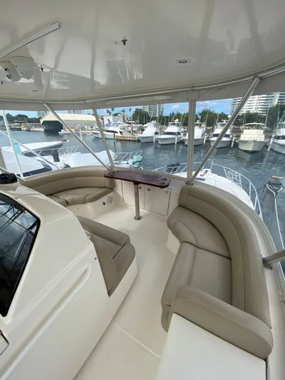  Yacht Photos Pics 2012 Tiara Yachts 48 Convertible with spacious seating and marina view.