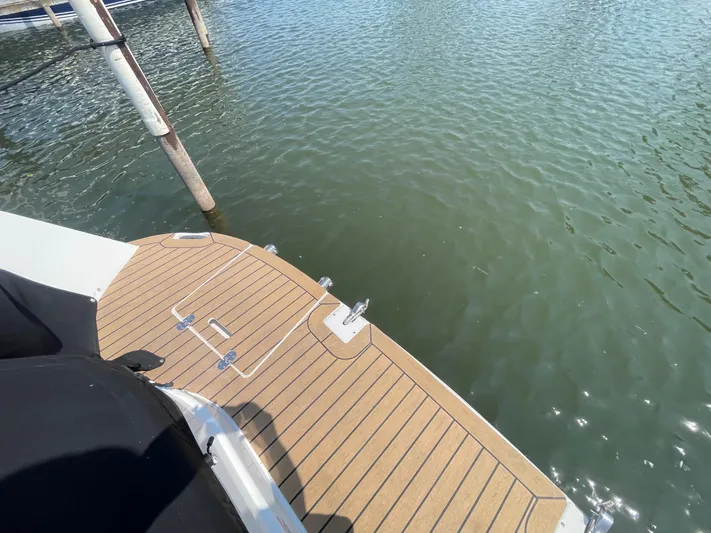  Yacht Photos Pics 2013 Rinker 310 Express Cruiser swim platform on calm water.