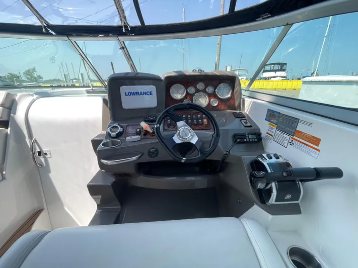  Yacht Photos Pics 2013 Rinker 310 Express Cruiser helm with Lowrance display and control panel.