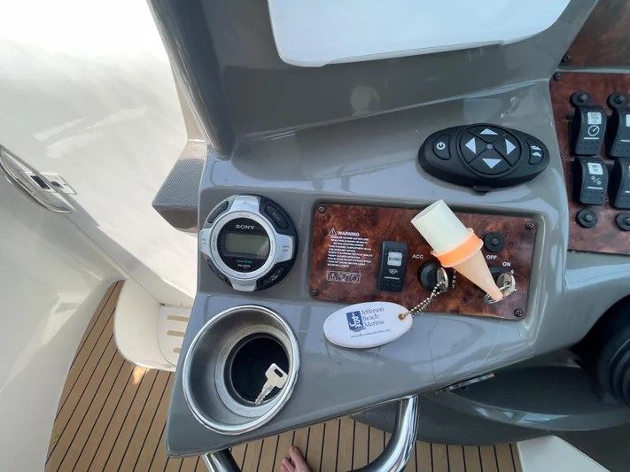  Yacht Photos Pics Control panel of a 2013 Rinker 310 Express Cruiser with keys and Sony stereo.