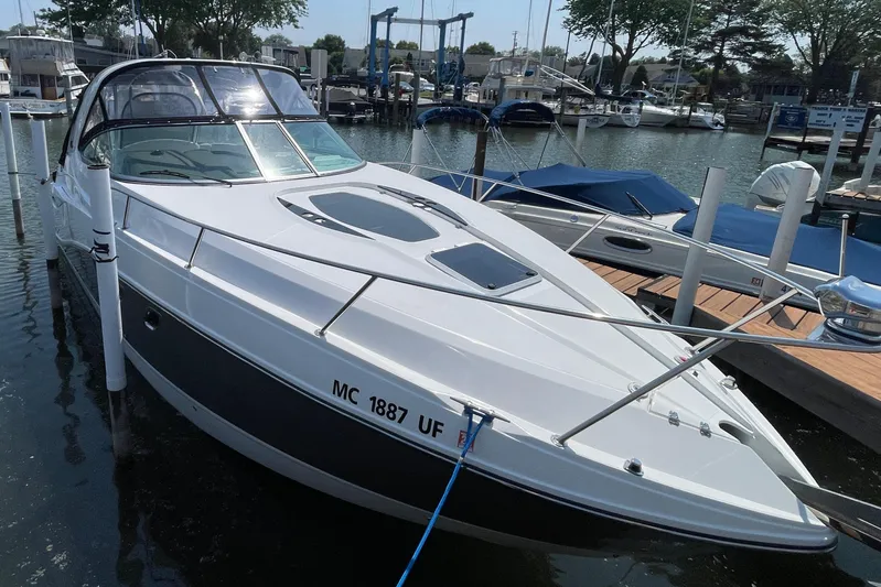  Yacht Photos Pics 2013 Rinker 310 Express Cruiser docked at marina, sleek design, sunny day.