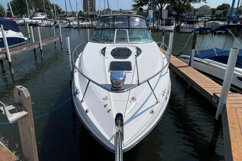  Yacht Photos Pics 2013 Rinker 310 Express Cruiser docked at marina, front view.