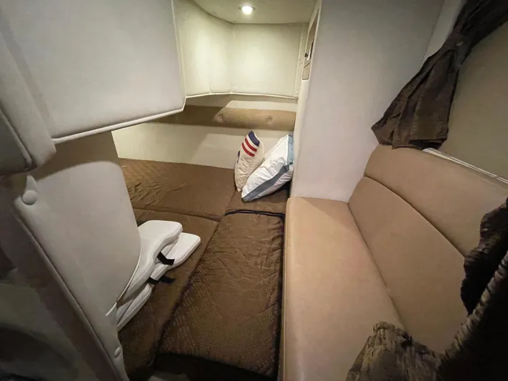  Yacht Photos Pics 2013 Rinker 310 Express Cruiser cabin interior with cozy seating and soft lighting.