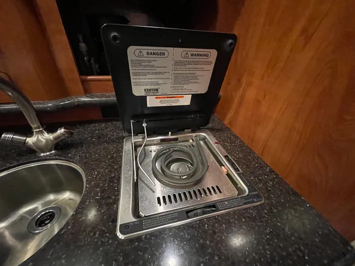  Yacht Photos Pics 2013 Rinker 310 Express Cruiser kitchen with stove and sink.