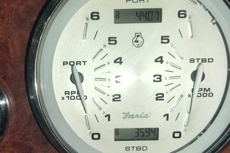  Yacht Photos Pics Close-up of a 2013 Rinker 310 Express Cruiser tachometer displaying RPM readings.