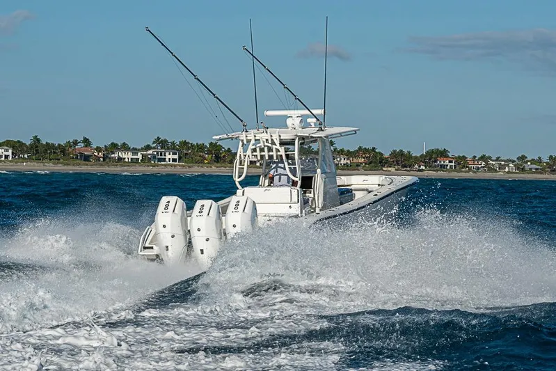 Quest Yacht Photos Pics 2011 Yellowfin 39 Offshore boat cruising on ocean with powerful engines.