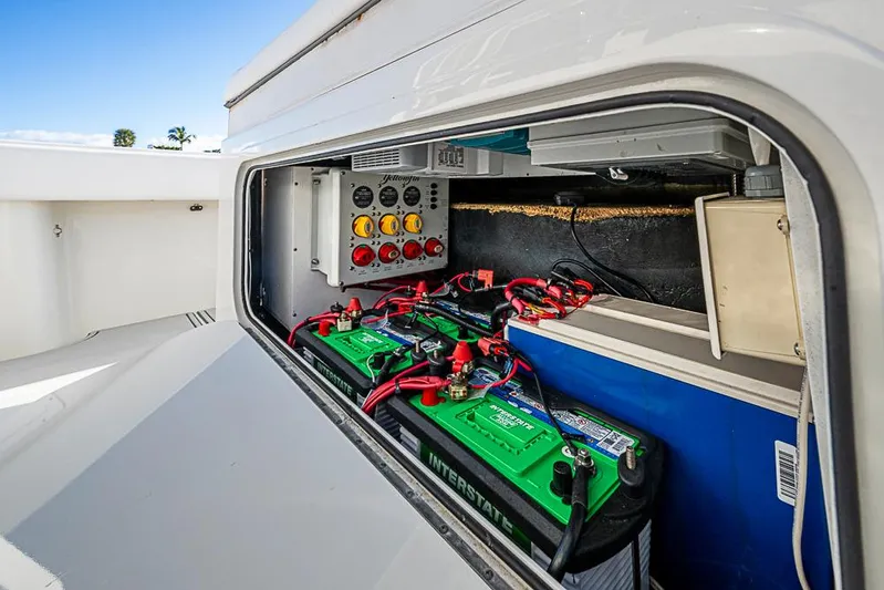 Quest Yacht Photos Pics 2011 Yellowfin 39 Offshore boat battery compartment with wiring and control panel.