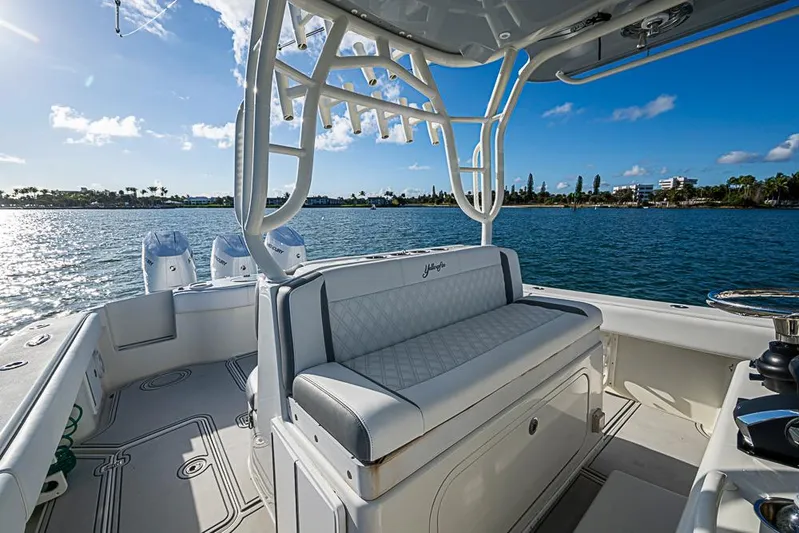 Quest Yacht Photos Pics 2011 Yellowfin 39 Offshore boat interior with seating, ocean view, and clear sky.