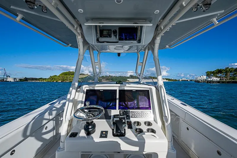 Quest Yacht Photos Pics 2011 Yellowfin 39 Offshore boat dashboard with ocean view and clear blue sky.