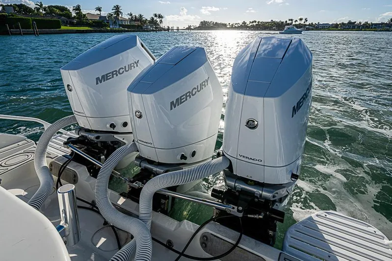 Quest Yacht Photos Pics 2011 Yellowfin 39 Offshore boat with triple Mercury Verado engines on water.